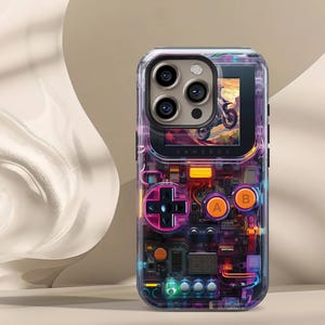 May include: Clear phone case with a retro video game design. The case features a D-pad, A and B buttons, and internal circuitry details. The screen displays a motorcycle image. The word "GAMEBOX" is printed on the case.