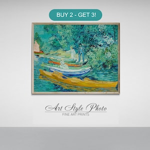 May include: A framed painting of a river scene with boats and trees in a style reminiscent of Vincent van Gogh. The painting is in a light wood frame and has a blue and green color scheme. The text "BUY 2 - GET 3!" is in a teal box above the painting. The text "Art Style Photo FINE ART PRINTS" is below the painting.