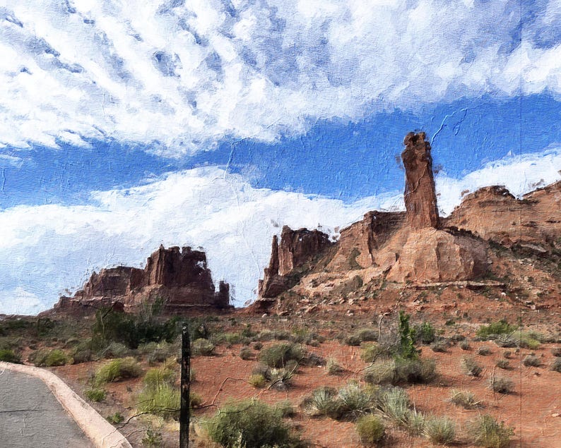 May include: An artistic rendering of a desert landscape under a bright blue sky with fluffy white clouds. The image features towering red rock formations and sparse desert vegetation, evoking a sense of the American Southwest.