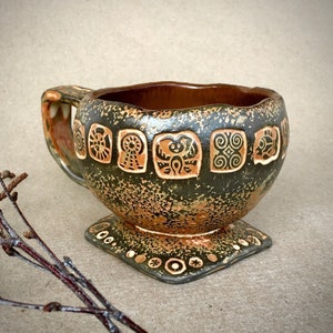 Tea cups with tribal symbols