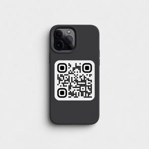May include: A black phone case with a white QR code on the back. The phone case has a camera lens cutout.
