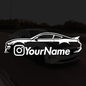 May include: White silhouette of a car with the Instagram logo and the text "YourName" on a black background.