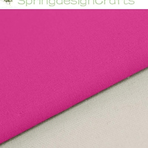 May include: A vibrant hot pink fabric with a visible woven texture, positioned diagonally across a neutral light grey surface. The text SpringdesignCrafts is displayed in a light green font at the top of the image.
