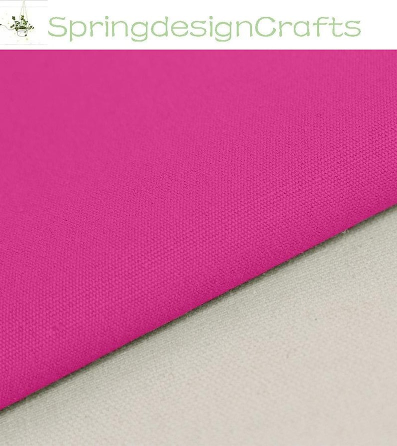 May include: A vibrant hot pink fabric with a visible woven texture, positioned diagonally across a neutral light grey surface. The text SpringdesignCrafts is displayed in a light green font at the top of the image.