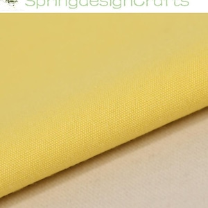 May include: A piece of solid light yellow fabric with a visible woven texture. The textile features a consistent, plain weave pattern throughout the material. The text SpringdesignCrafts is displayed in green at the top of the image.