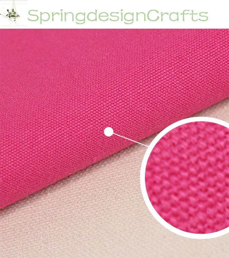 May include: A vibrant hot pink fabric with a visible woven texture. The material features a tight, uniform weave pattern. A circular inset provides a magnified view of the fabric surface, highlighting the individual threads and the consistent pink colour.