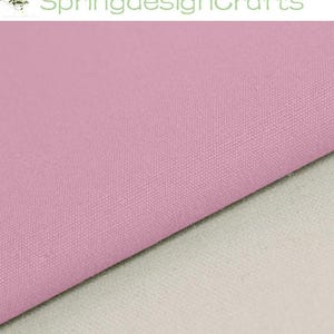 May include: A solid light pink fabric with a visible woven texture, positioned diagonally across the frame, revealing a plain off-white fabric layer underneath. The text SpringdesignCrafts is displayed in green at the top of the image.