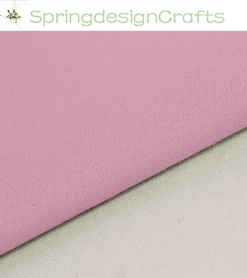 May include: A solid light pink fabric with a visible woven texture, positioned diagonally across the frame, revealing a plain off-white fabric layer underneath. The text SpringdesignCrafts is displayed in green at the top of the image.