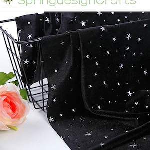 May include: Black velvet fabric with a scattered star pattern and small, sparkling accents. The fabric is draped over a black wire basket, with a pink rose in the foreground. The text "SpringdesignCrafts" is visible in the top left corner.