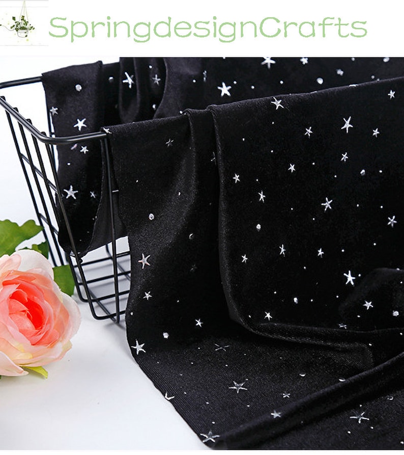 May include: Black velvet fabric with a scattered star pattern and small, sparkling accents. The fabric is draped over a black wire basket, with a pink rose in the foreground. The text "SpringdesignCrafts" is visible in the top left corner.