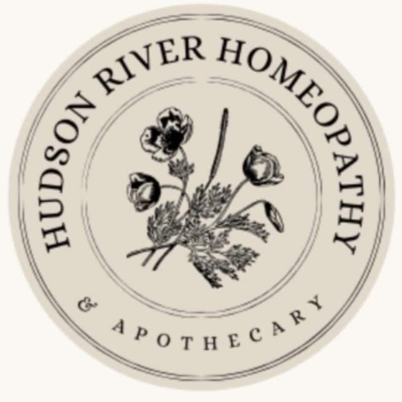 May include: A circular logo with the text "HUDSON RIVER HOMEOPATHY & APOTHECARY" in a cream-coloured circle. The logo features a botanical illustration of flowers and leaves in black and white.