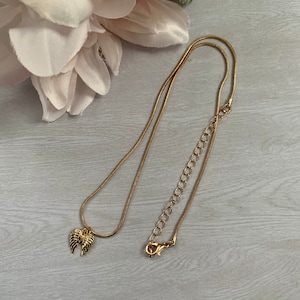 Gold Necklace with Wing Charm