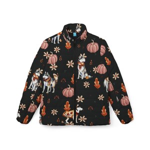 May include: A black puffer jacket with a zip fastening features a repeating pattern of pumpkins, leaves, and husky dogs wearing scarves.