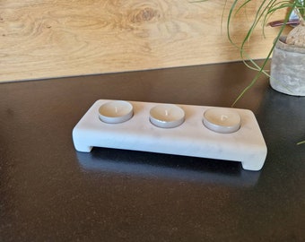 Triple candle holder for tealights in Carrara marble.