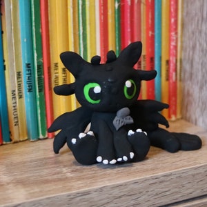 Black dragon with fish, toothless, made on order
