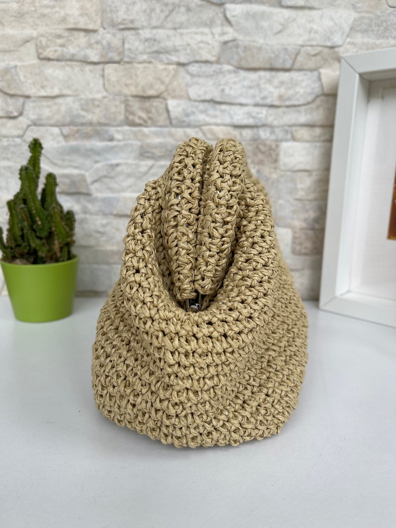The Crochet Raffia bag is perfect for any occasion.