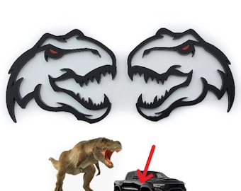 Nuevo emblema de cabeza de T-rex, insignia de guardabarros con ojos rojos