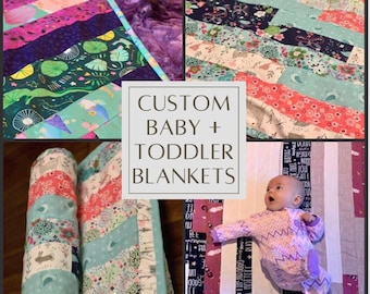May include: A close-up of a custom baby and toddler blanket with a variety of colorful fabrics. The blanket is made with a patchwork design and features a variety of floral and geometric patterns. The blanket is rolled up and displayed on a wooden surface. The text "CUSTOM BABY + TODDLER BLANKETS" is displayed on the image.