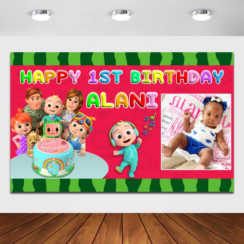 May include: A colorful Happy 1st Birthday banner with a watermelon pattern. The banner features a group of cartoon characters, a cake, and a photo of a baby girl. The banner says "Happy 1st Birthday Alani".