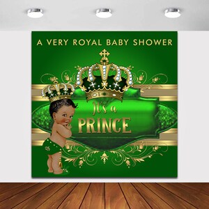 May include: A green and gold baby shower backdrop with the text "A Very Royal Baby Shower" and "It's a Prince". The backdrop features a crown, a baby boy, and gold and green floral designs.