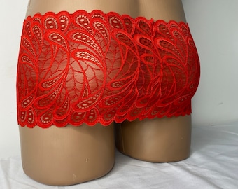 May include: Red lace underwear with a paisley pattern.