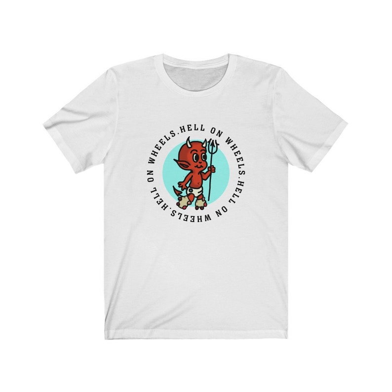 May include: White t-shirt featuring a cartoon devil with a trident, set within a teal circle. The text "HELL ON WHEELS" encircles the graphic. The devil is red with horns and is wearing a diaper.