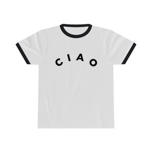 May include: White t-shirt with black trim on the collar and sleeves. The word "CIAO" is printed in black, arched across the front of the shirt. The shirt is made of a soft, comfortable material.