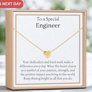 May include: A gold heart charm necklace in a gift box with a card that reads "To a Special Engineer". The card says "Your dedication and hard work make a difference every day. Wear this heart charm as a symbol of your passion, strength, and the positive impact you bring to the world. Keep shining bright in all that you do."