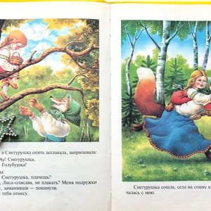 May include: A red fox wearing a blue dress and a green headscarf carries a young girl in a blue dress and a red headscarf through a forest. The girl is holding a basket of red berries. The fox has a bushy red tail.
