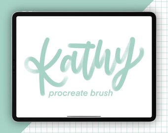 May include: A digital tablet displays the word "Kathy" in a light teal script font, with "procreate brush" in a smaller font below. The tablet is black with a white screen, set against a white background with a teal and grid pattern.