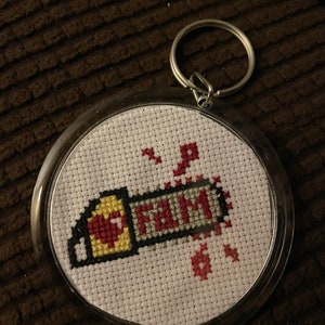 Saw is Fam “TCM2” cross stitch keychain
