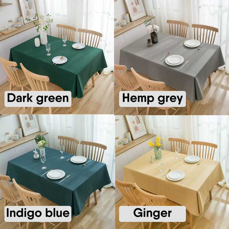 May include: Four tablecloths in different colors: dark green, hemp grey, indigo blue, and ginger. Each tablecloth is laid on a wooden table with two chairs on each side. The tablecloths are made of a linen-like material.