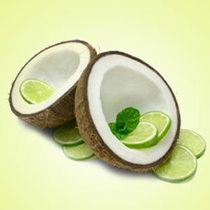 May include: Two halves of a coconut shell with lime slices and mint leaves inside. The coconut halves are sitting on a white surface with more lime slices around them.