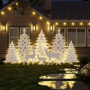 May include: White silhouette cutouts of Christmas trees and reindeer in front of a brick house with fairy lights.