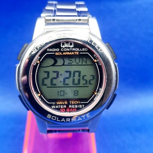 Vintage Q&Q radio control Solarmate watch.
