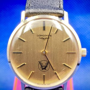 Vintage LONGINES Hand-Winding Gold Color watch. Eagle Mark. 10 Microns Unisex watch.