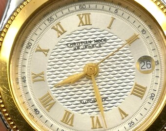 Vintage and rare Christian Mode gold color Swiss watch.