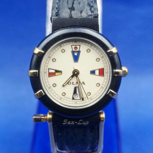 Vintage OLMA Sea-Cup lady quartz watch. Width size about 28 mm. Include crown.