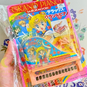 Gloednieuwe vintage sailormoon prisma vleugelpiano uit 1992 met bladmuziek