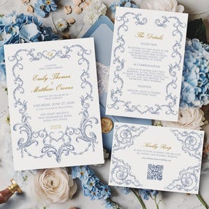 May include: A wedding invitation suite with a blue and white floral design. The set includes an invitation, details card, and RSVP card. The invitation displays the names "Emily Thomas & Matthew Owens" and the date "June 27, 2020".