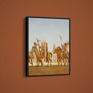 May include: Framed print of a historical painting depicting Native American figures on horseback. The artwork features several riders in traditional attire, with feathered headdresses and spears, set against a backdrop of teepees and a pale blue sky. The color palette is dominated by earth tones.