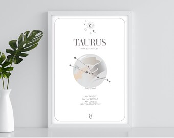 Könnte beinhalten: Ein weißer gerahmter Druck mit einem minimalistischen Design, das das Sternzeichen Stier zeigt. Der Druck enthält die Daten vom 20. April bis 20. Mai, die Konstellation und den Text "Regiert von Venus" und "Ich bin geduldig, ich bin ehrgeizig, ich bin liebevoll, ich bin vertrauenswürdig".