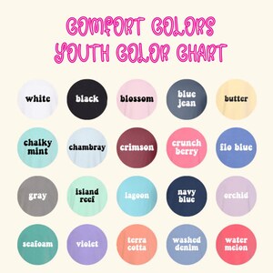 May include: A color chart for Comfort Colors youth apparel. The chart displays a variety of colors, including white, black, blossom, blue jean, butter, chalky mint, chambray, crimson, crunch berry, flo blue, gray, island reef, lagoon, navy blue, orchid, seafoam, violet, terra cotta, washed denim, and water melon.