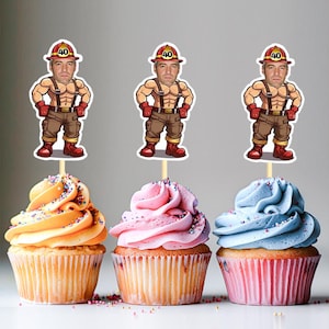 May include: Three cupcakes with different colored frosting and sprinkles. Each cupcake has a topper with a cartoon image of a man dressed as a firefighter with the number 40 on his hat.