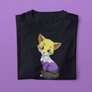 May include: A black t-shirt featuring a cartoon fox wearing yellow, purple and white colours. The fox is sitting on its hind legs and looking to the left.