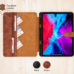 May include: A brown top grain leather tablet case with a magnetic closure, featuring three interior card slots and a dedicated stylus holder. The case is shown open with a tablet displaying a colourful abstract screen, alongside two colour swatches.
