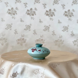 Korean Traditional Handmade White Celadon Oil or Incense Vase with Red Plum Pattern (청자 백상감 매화문 유병)