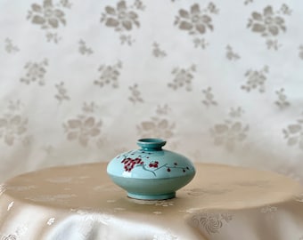 Korean Traditional Handmade White Celadon Oil or Incense Vase with Red Plum Pattern (청자 백상감 매화문 유병)