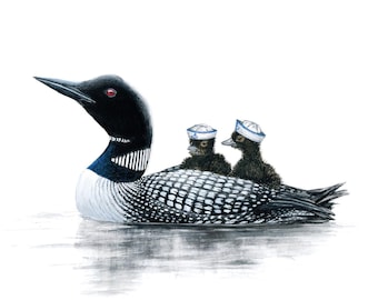 May include: A black and white loon with two chicks wearing blue and white sailor hats. The loon is swimming in a body of water.