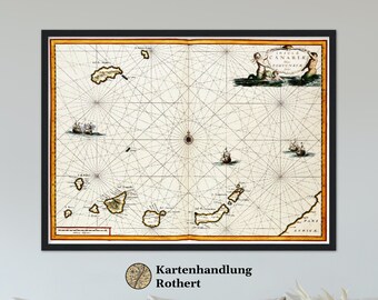 May include: An antique map of the Canary Islands, titled "Insulae Canarie Fortunatae." The map is printed on aged paper with a grid pattern and features a compass rose, ships, and islands labeled in Latin. The map is framed in a black frame.